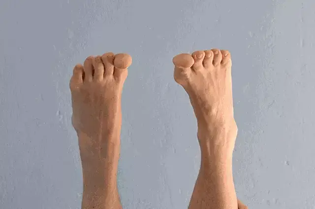 Person holding legs up in air