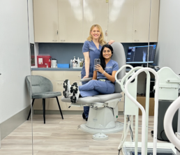 Dr. Mona Ramani and Dr. Erin Koprince taking a selfie in a patient room at AIRE Podiatry Studio